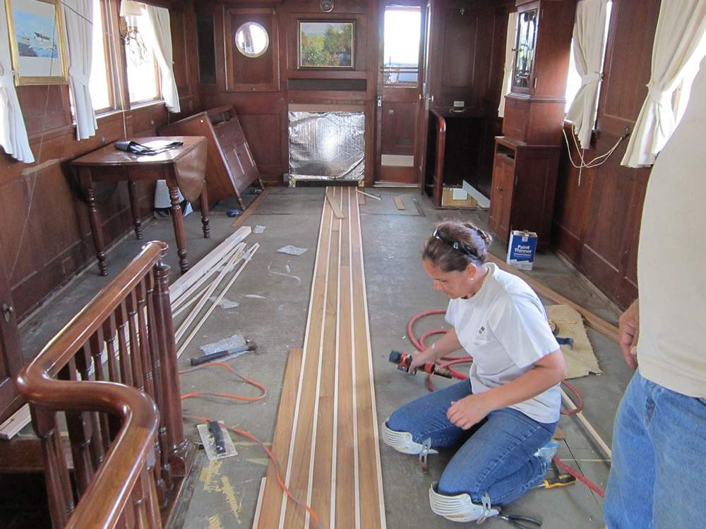 Cal & Son installer at work on a hardwood floor